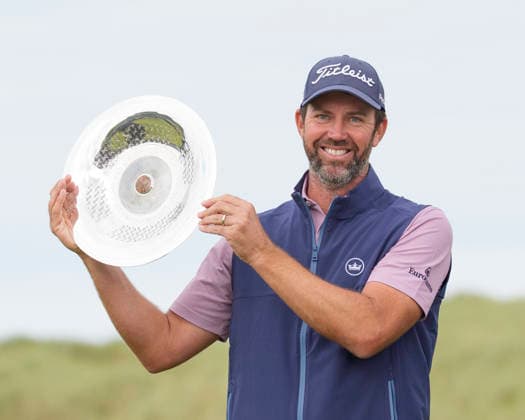 BALMEDIE, SCOTLAND - AUG 23: Scott Jamieson (SCO) hold the trophy aloft after winning The Nexo Championship during Round 4 at the 2026 Nexo Championship at the Trump International Golf Links, Balmedie on August 23, 2026 in Aberdeenshire, Scotland The 2026 Nexo Championship
