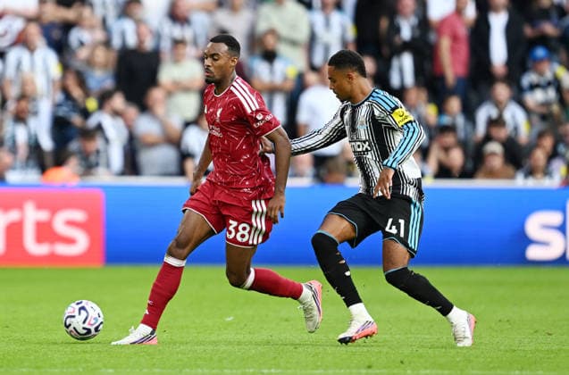 Newcastle Upon Tyne, England, 23rd August 2026. Ryan Gravenberch of Liverpool tackled by Jacob Ramsey of Newcastle United during the Newcastle United vs Liverpool Premier League match at St. James Park, Newcastle Upon Tyne. Picture credit should read: Anna Gowthorpe Sportimage EDITORIAL USE ONLY. No use with unauthorised audio, video, data, fixture lists, club league logos or live services. Online in-match use limited to 120 images, no video emulation. No use in betting, games or single club league player publications. SPI_045_AG_Newcastle_Liverpool SPI-4932-0044