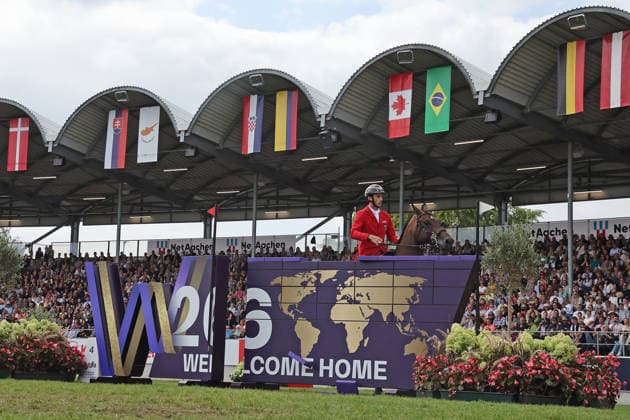 Richard Vogel (GER, Deutschland) mit Pferd Unites Touch S, aktueller Europameister und Sieger des Rolex Grand Prix von Aachen 2026 (CHIO Aachen) scheitert an der WM-Mauer, Springfehler , Springen, FEI Jumping World Championship, WM, Weltmeisterschaft , FEI Jumping World Championship, Competition Individual Final, Longines-Prize, Longines-Preis, Finale Einzelwertung, Jumping , AACHEN - FEI World Championships 2026, Weltfest des Pferdesports, Reitsport Weltmeisterschaft 2026, Aachen 2026, Welcome Home 2026, Aachener Soers, 11. bis 23. August 2026, Reitsport, 23.08.2026, Aachen Aachener Soers Deutschland *** Richard Vogel (GER, Germany), riding Unites Touch S, the reigning European champion and winner of the 2026 Rolex Grand Prix at CHIO Aachen, fails to clear the World Championship wall; jumping fault; show jumping; FEI Jumping World Championship; FEI Jumping World Championship, Individual Final, Longines Prize, Jumping, AACHEN FEI World Championships 2026, World Equestrian Festival, 2026 World Equestrian Games, Aachen 2026, Welcome Home 2026, Aachen Soers, August 11–23, 2026, Equestrian Sports, August 23, 2026, Aachen Soers, Germany