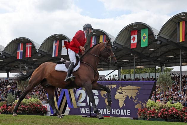 Richard Vogel (GER, Deutschland) mit Pferd Unites Touch S, aktueller Europameister und Sieger des Rolex Grand Prix von Aachen 2026 (CHIO Aachen) scheitert an der WM-Mauer, Springfehler , Springen, FEI Jumping World Championship, WM, Weltmeisterschaft , FEI Jumping World Championship, Competition Individual Final, Longines-Prize, Longines-Preis, Finale Einzelwertung, Jumping , AACHEN - FEI World Championships 2026, Weltfest des Pferdesports, Reitsport Weltmeisterschaft 2026, Aachen 2026, Welcome Home 2026, Aachener Soers, 11. bis 23. August 2026, Reitsport, 23.08.2026, Aachen Aachener Soers Deutschland *** Richard Vogel (GER, Germany), riding Unites Touch S, the reigning European champion and winner of the 2026 Rolex Grand Prix at CHIO Aachen, fails to clear the World Championship wall; jumping fault; show jumping; FEI Jumping World Championship; FEI Jumping World Championship, Individual Final, Longines Prize, Jumping, AACHEN FEI World Championships 2026, World Equestrian Festival, 2026 World Equestrian Games, Aachen 2026, Welcome Home 2026, Aachen Soers, August 11–23, 2026, Equestrian Sports, August 23, 2026, Aachen Soers, Germany
