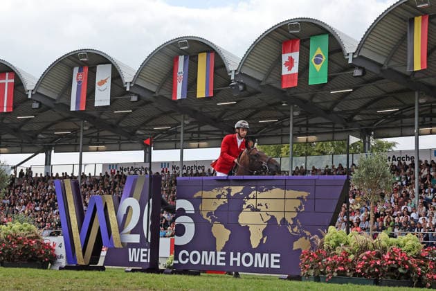 Richard Vogel (GER, Deutschland) mit Pferd Unites Touch S, aktueller Europameister und Sieger des Rolex Grand Prix von Aachen 2026 (CHIO Aachen) scheitert an der WM-Mauer, Springfehler , Springen, FEI Jumping World Championship, WM, Weltmeisterschaft , FEI Jumping World Championship, Competition Individual Final, Longines-Prize, Longines-Preis, Finale Einzelwertung, Jumping , AACHEN - FEI World Championships 2026, Weltfest des Pferdesports, Reitsport Weltmeisterschaft 2026, Aachen 2026, Welcome Home 2026, Aachener Soers, 11. bis 23. August 2026, Reitsport, 23.08.2026, Aachen Aachener Soers Deutschland *** Richard Vogel (GER, Germany), riding Unites Touch S, the reigning European champion and winner of the 2026 Rolex Grand Prix at CHIO Aachen, fails to clear the World Championship wall; jumping fault; show jumping; FEI Jumping World Championship; FEI Jumping World Championship, Individual Final, Longines Prize, Jumping, AACHEN FEI World Championships 2026, World Equestrian Festival, 2026 World Equestrian Games, Aachen 2026, Welcome Home 2026, Aachen Soers, August 11–23, 2026, Equestrian Sports, August 23, 2026, Aachen Soers, Germany