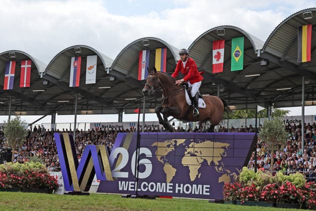 Richard Vogel (GER, Deutschland) mit Pferd Unites Touch S, aktueller Europameister und Sieger des Rolex Grand Prix von Aachen 2026 (CHIO Aachen) scheitert an der WM-Mauer, Springfehler , Springen, FEI Jumping World Championship, WM, Weltmeisterschaft , FEI Jumping World Championship, Competition Individual Final, Longines-Prize, Longines-Preis, Finale Einzelwertung, Jumping , AACHEN - FEI World Championships 2026, Weltfest des Pferdesports, Reitsport Weltmeisterschaft 2026, Aachen 2026, Welcome Home 2026, Aachener Soers, 11. bis 23. August 2026, Reitsport, 23.08.2026, Aachen Aachener Soers Deutschland *** Richard Vogel (GER, Germany), riding Unites Touch S, the reigning European champion and winner of the 2026 Rolex Grand Prix at CHIO Aachen, fails to clear the World Championship wall; jumping fault; show jumping; FEI Jumping World Championship; FEI Jumping World Championship, Individual Final, Longines Prize, Jumping, AACHEN FEI World Championships 2026, World Equestrian Festival, 2026 World Equestrian Games, Aachen 2026, Welcome Home 2026, Aachen Soers, August 11–23, 2026, Equestrian Sports, August 23, 2026, Aachen Soers, Germany