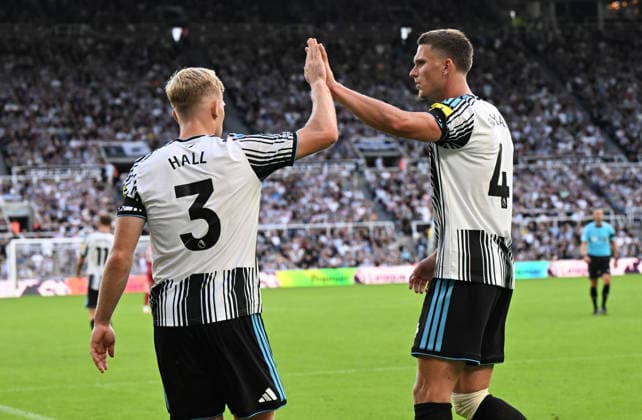 Newcastle Upon Tyne, England, 23rd August 2026. Lewis Hall of Newcastle United celebrates a tackle with Sven Botman of Newcastle United during the Newcastle United vs Liverpool Premier League match at St. James Park, Newcastle Upon Tyne. Picture credit should read: Anna Gowthorpe Sportimage EDITORIAL USE ONLY. No use with unauthorised audio, video, data, fixture lists, club league logos or live services. Online in-match use limited to 120 images, no video emulation. No use in betting, games or single club league player publications. SPI_047_AG_Newcastle_Liverpool SPI-4932-0047