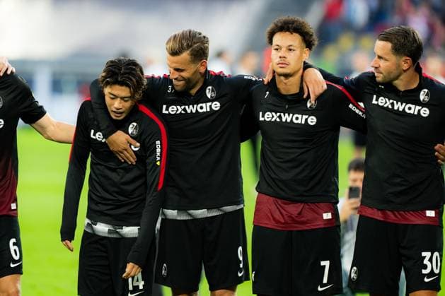 Fortuna Düsseldorf v SC Freiburg - DFB-Pokal First Round SC Freiburg players Yuito Suzuki (14), Lucas Hoeler (9), Derry Scherhant (7) and Christian Guenter (30) celebrate together after the final whistle following their victory over Fortuna Dusseldorf in the DFB-Pokal first round at Merkur Spiel-Arena in Dusseldorf, Germany, August 23, 2026. Dusseldorf Merkur Spiel-Arena North Rhine-Westphalia Germany Copyright: xTaiseixIwamotox