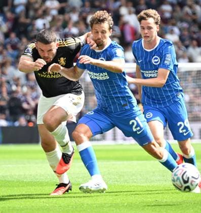 John McGinn of Aston Villa and Olivier Boscagli of Brighton battle for the ball during the Premier League match between Brighton and Hove Albion and Aston Villa at the American Express Stadium, Brighton UK - Sunday 23rd August 2026 Brighton v Aston Villa Premier League Football, Amex Stadium, Sussex, UK - 23 Aug 2026Brighton Amex Stadium Sussex United Kingdom EDITORIAL USE ONLY No use with unauthorised audio, video, data, fixture lists, club league logos or live services. Online in-match use limited to 120 images, no video emulation. No use in betting, games or single club league player publications. . No mer  Copyright: xLizxFinlayson TPI Shutterstockx 17113558bm