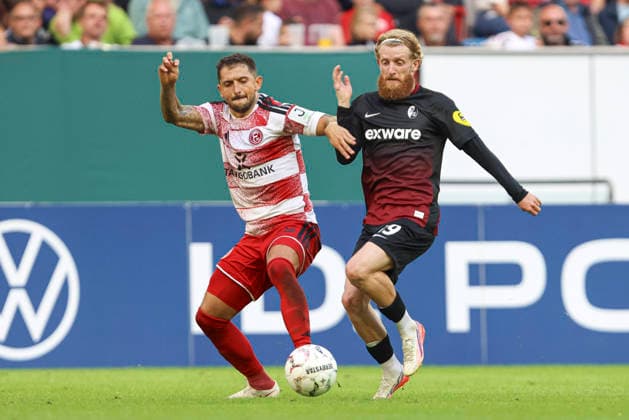 Matthias Zimmermann (Fortuna Duesseldorf) und Jan-Niklas Beste (SC Freiburg) im Zweikampf waehrend des Spiels der 1. Runde des DFB-Pokal zwischen Fortuna Duesseldorf und SC Freiburg, Merkur Spiel-Arena am 23. August 2026 in Duesseldorf, Deutschland. (Foto von Oliver Kaelke DeFodi Images) +++ Matthias Zimmermann (Fortuna Duesseldorf) und Jan-Niklas Beste (SC Freiburg) battle for the ball during the 1st round match of the DFB-Pokal between Fortuna Duesseldorf and SC Freiburg at Merkur Spiel-Arena on August 23, 2026 in Dusseldorf, Germany. (Photo by Oliver Kaelke DeFodi Images) DFB DFL REGULATIONS PROHIBIT ANY USE OF PHOTOGRAPHS AS IMAGE SEQUENCES AND OR QUASI-VIDEO. (Photo by Oliver Kaelke DeFodi Images) - *** Matthias Zimmermann of Fortuna Düsseldorf and Jan Niklas Beste of SC Freiburg battle for the ball during the first-round match of the DFB Cup between Fortuna Düsseldorf and SC Freiburg at the Merkur Spiel Arena on August 23, 2026, in Düsseldorf, Germany. Photo by Oliver Kaelke, DeFodi Images. Matthias Zimmermann of Fortuna Düsseldorf and Jan Niklas Beste of SC Freiburg battle for the ball during the first-round match of the DFB Cup between Fortuna Düsseldorf and SC Freiburg at Merkur Spiel Arena on August 23, 2026 in Düsseldorf, Germany Photo by Oliver Kaelke, DeFodi Images DFB and DFL regulations prohibit any use of photographs as image sequences and or quasi-video Photo by Oliver Kaelke, DeFodi Images
