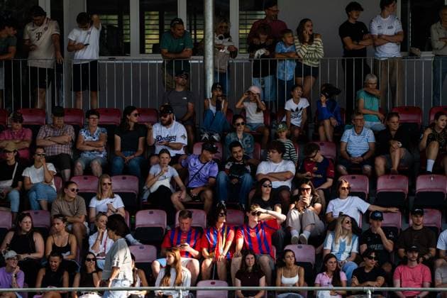 DÜDINGEN, FRIBOURG - AUGUST 23: Three FC Basel 1893 supporters stand out from the crowd during the AXA Women’s Swiss Cup match between SC Düdingen and FC Basel 1893 at FKB Stadion Birchhölzli on August 23, 2026 in Düdingen, Fribourg, Switzerland.  Copyright: xLivioxBaeriswylx xSPPx Sportspressphoto_SPR213784