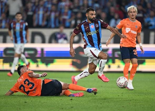 Trabzonspor v Basaksehir - Turkish Super Lig TRABZON, TURKIYE - AUGUST 23 : Mohamed Salah of Trabzonspor in action against Emin Bayram of Basaksehir during the Turkish Super Lig match between Trabzonspor and Istanbul Basaksehir at Papara Park in Trabzon, Turkiye on August 23, 2026. Hakan Burak Altunoz Anadolu Trabzon Turkey. Editorial use only. Please get in touch for any other usage.  Copyright: x2026xAnadoluxHakanxBurakxAltunozx