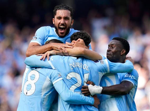 Manchester, England, 23rd August 2026. JoÅ¡ko Gvardiol of Manchester City (C) is congratulated by Rayan Cherki of Manchester City (UP) Marc Guehi of Manchester City (R) and Jack Grealish of Manchester City after scoring the winning goal during the Manchester City vs AFC Bournemouth Premier League match at the Etihad Stadium, Manchester. Picture credit should read: Andrew Yates Sportimage EDITORIAL USE ONLY. No use with unauthorised audio, video, data, fixture lists, club league logos or live services. Online in-match use limited to 120 images, no video emulation. No use in betting, games or single club league player publications. SPI_074_AY_Man_City_Bournemouth SPI-4930-0075