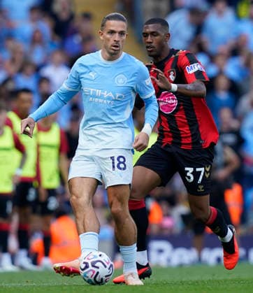 Manchester, England, 23rd August 2026. Jack Grealish of Manchester City (L) is challenged by Rayan of AFC Bournemouth during the Manchester City vs AFC Bournemouth Premier League match at the Etihad Stadium, Manchester. Picture credit should read: Andrew Yates Sportimage EDITORIAL USE ONLY. No use with unauthorised audio, video, data, fixture lists, club league logos or live services. Online in-match use limited to 120 images, no video emulation. No use in betting, games or single club league player publications. SPI_081_AY_Man_City_Bournemouth SPI-4930-0082