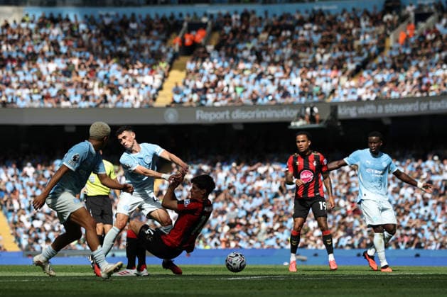 23rd August 2026; Etihad Stadium, Manchester, Lancashire, England; Premier League Football, Manchester City versus AFC Bournemouth; Phil Foden of Manchester City is tackled by Antonio Silva of Bournemouth DavidxBlunsden