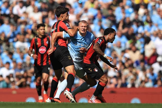 23rd August 2026; Etihad Stadium, Manchester, Lancashire, England; Premier League Football, Manchester City versus AFC Bournemouth; Erling Haaland of Manchester City is tackled by Antonio Silva of Bournemouth DavidxBlunsden