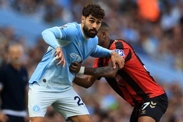 23rd August 2026; Etihad Stadium, Manchester, Lancashire, England; Premier League Football, Manchester City versus AFC Bournemouth; Josko Gvardiol of Manchester City holds off a challenge from Rayan of Bournemouth DavidxBlunsden