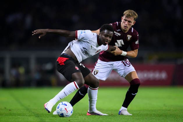 Torino FC v AC Milan - Serie A Alphadjo Cisse of AC Milan competes for the ball with Marcus Pedersen of Torino FC during the Serie A football match between Torino FC and AC Milan. Turin Italy Copyright: xNicolòxCampox