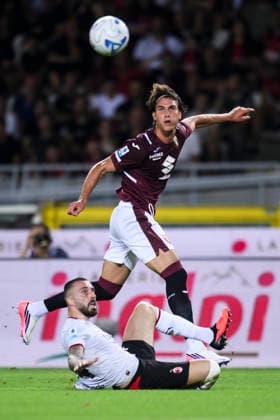 Torino FC v AC Milan - Serie A Cesare Casadei of Torino FC is tackled by Mario Gila of AC Milan during the Serie A football match between Torino FC and AC Milan. Turin Italy Copyright: xNicolòxCampox
