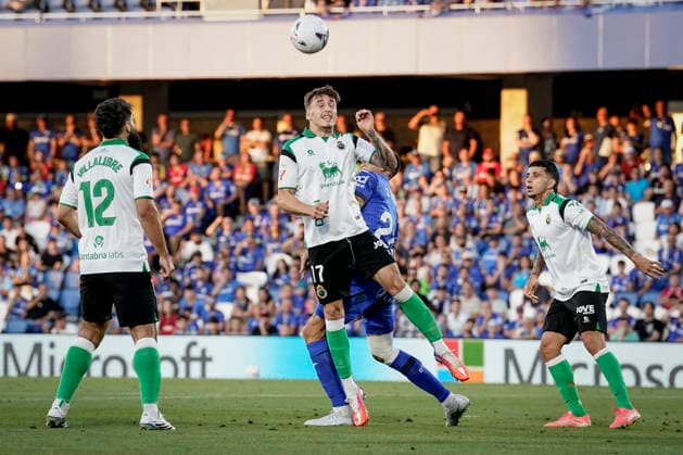August 23, 2026, Getafe, Madrid, Spain: Johan Mojica of Getafe CF and Jorge Salinas of Real Racing Club in action during the Spanish League, LaLiga EA Sports, football match played between Getafe CF and Real Racing Club de Santander at Coliseum de Getafe stadium on August 23, 2026, in Getafe, Madrid, Spain. Getafe Spain - ZUMAa181 20260823_zaa_a181_132 Copyright: xAngelxPerezxMecax