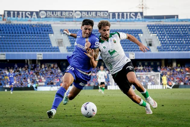 August 23, 2026, Getafe, Madrid, Spain: Martin Satriano of Getafe CF and Pablo Ramon of Real Racing Club in action during the Spanish League, LaLiga EA Sports, football match played between Getafe CF and Real Racing Club de Santander at Coliseum de Getafe stadium on August 23, 2026, in Getafe, Madrid, Spain. Getafe Spain - ZUMAa181 20260823_zaa_a181_134 Copyright: xAngelxPerezxMecax