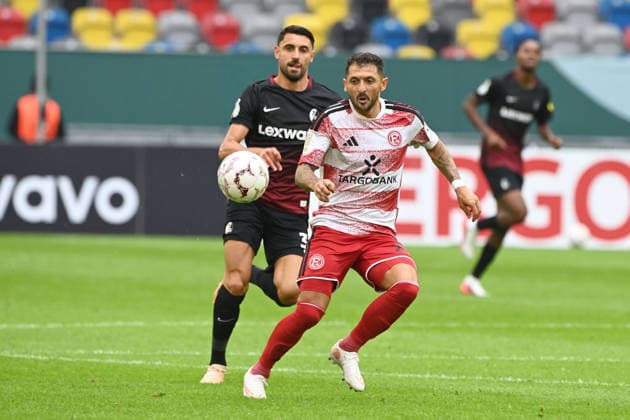Matthias ZIMMERMANN (D) gegen Vincenzo GRIFO (FR) Aktion, Zweikampf, Fussball DFB Pokal, 1. Hauptrunde, Fortuna Duesseldorf (D) - SC Freiburg (FR) 1-5 am 23.08.2026 in der Merkur Spiel Arena Duesseldorf Deutschland. DFL DFB regulations prohibit any use of photographs as image sequences and or quasi-video Â *** Matthias ZIMMERMANN (D) vs. Vincenzo GRIFO (FR) – Action, Tackle, Soccer, DFB Cup, 1st Round, Fortuna Düsseldorf D vs. SC Freiburg FR 1:5 on August 23, 2026, at the Merkur Spiel Arena in Düsseldorf, Germany. DFL and DFB regulations prohibit any use of photographs as image sequences and or quasi-video.