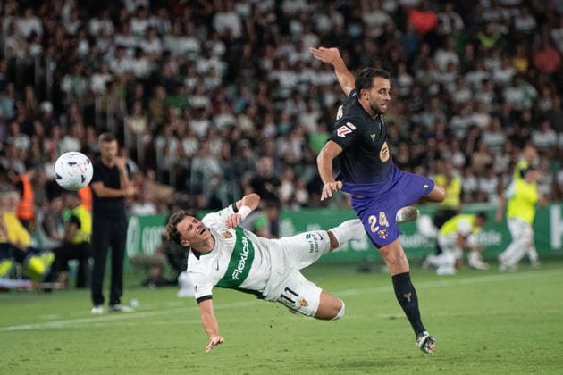 August 23, 2026, Elche, Alicante, Spain: 24 ERIC GARCIA heading against 11 GERMAN VALERA during the match between Elche CF and FC Barcelona, Barca from LaLiga EASports, matchweek 2, disputed at the MartoÂ­nez Valero stadium, Alicante Elche Spain - ZUMAc290 20260823_zsp_c290_053 Copyright: xJordixCantox
