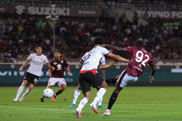 Torino v AC Milan - Serie A - Stadio Grande Torino Turin, Italy, 23rd August 2026. Koni De Winter of AC Milan challenges Alieu Njie of Torino FC as he fires a shot against the upright during the Torino vs AC Milan Serie A match at Stadio Grande Torino, Turin. Picture credit should read: Jonathan Moscrop Turin Stadio Olimpico Grande Torino Italy
