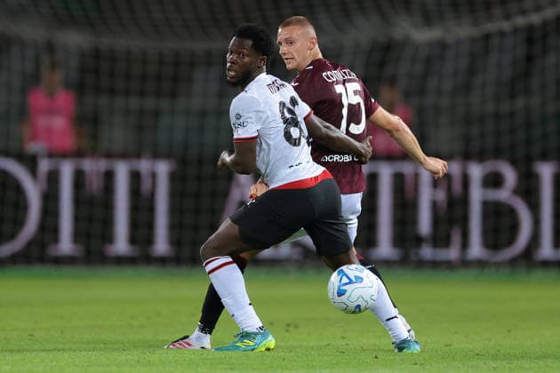 Torino v AC Milan - Serie A - Stadio Grande Torino Turin, Italy, 23rd August 2026. Pietro Comuzzo of Torino FC clears from Yunus Musah of AC Milan during the Torino vs AC Milan Serie A match at Stadio Grande Torino, Turin. Picture credit should read: Jonathan Moscrop Turin Stadio Olimpico Grande Torino Italy