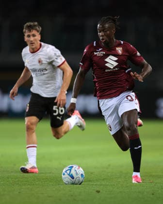 Torino v AC Milan - Serie A - Stadio Grande Torino Turin, Italy, 23rd August 2026. Alieu Njie of Torino FC is pursued by Alexis Saelemaekers of AC Milan as he breaks with the ball during the Torino vs AC Milan Serie A match at Stadio Grande Torino, Turin. Picture credit should read: Jonathan Moscrop Turin Stadio Olimpico Grande Torino Italy