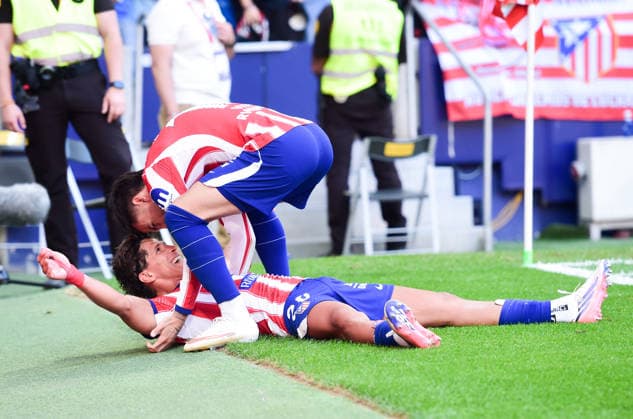 (260824) -- MADRID, Aug. 24, 2026 -- Atletico Madrid s Giuliano Simeone (down) celebrates with teammate Alex Baena during the Spanish La Liga football match between Atletico de Madrid and Villarreal at Metropolitano stadium in Madrid, Spain, Aug. 23, 2026. (Photo by Xinhua) (SP)SPAIN-MADRID-FOOTBALL-LALIGA-ATLETICO DE MADRID VS VILLARREAL GustavoxValiente 