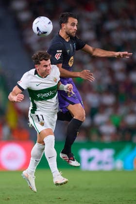 (260824) -- ELCHE, Aug. 24, 2026 -- Barcelona s Erik Garcia (top) vies with Elche s German Valera during the Spanish La Liga football match between Elche CF and FC Barcelona, Barca in Elche, Spain, Aug. 23, 2026. ( Xinhua) (SP) SPAIN-ELCHE-FOOTBALL-LA LIGA-ELCHE CF VS FC BARCELONA Str 