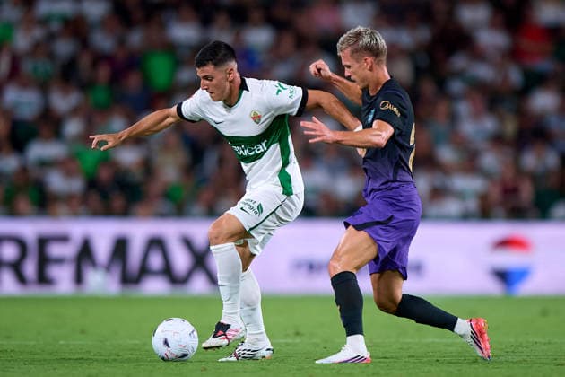 (260824) -- ELCHE, Aug. 24, 2026 -- Barcelona s Dani Olmo (R) vies with Elche s Martim Neto during the Spanish La Liga football match between Elche CF and FC Barcelona, Barca in Elche, Spain, Aug. 23, 2026. ( Xinhua) (SP) SPAIN-ELCHE-FOOTBALL-LA LIGA-ELCHE CF VS FC BARCELONA Str 