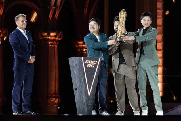 Emmanuel Macron And Mohammed Bin Salman Attend Esports World Cup Closing Ceremony - Paris France s President Emmanuel Macron presents the EWC 2026 Club champions award to team All Gamers (AG AL) including club chairman Le Kedeng during the closing ceremony of the Esports World Cup at the Grand Palais in Paris, on August 23, 2026. Photo by Raphael Lafargue ABACAPRESS.COM Paris Ile-de-France France  Copyright: xLafarguexRaphael ABACAx