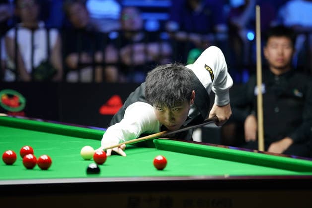 WUHAN, CHINA - AUGUST 24: Zhao Xintong of China plays a shot in the second round match against Gao Yang of China on day 2 of Wuhan Open 2026 at the Optics Valley Gymnasium of Huazhong University of Science and Technology on August 24, 2026 in Wuhan, Hubei Province of China.  Copyright: xTaixChengzhex 111661852704