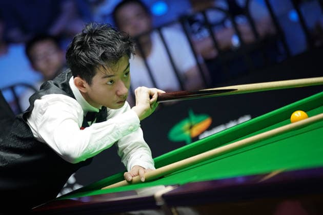 WUHAN, CHINA - AUGUST 24: Wu Yize of China plays a shot in the second round match against Artemijs Zizins of Latvia on day 2 of Wuhan Open 2026 at the Optics Valley Gymnasium of Huazhong University of Science and Technology on August 24, 2026 in Wuhan, Hubei Province of China.  Copyright: xTaixChengzhex 111661853324