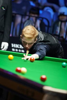 WUHAN, CHINA - AUGUST 24: Artemijs Zizins of Latvia plays a shot in the second round match against Wu Yize of China on day 2 of Wuhan Open 2026 at the Optics Valley Gymnasium of Huazhong University of Science and Technology on August 24, 2026 in Wuhan, Hubei Province of China.  Copyright: xTaixChengzhex 111661853310