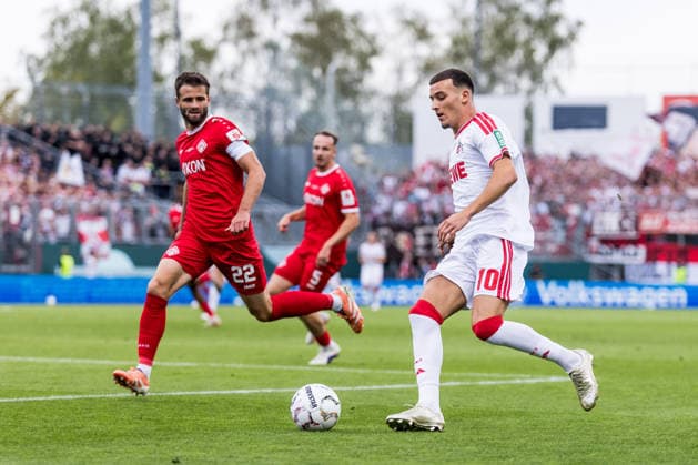 WUERZBURG, GERMANY - AUGUST 24: Said El Mala (1. FC Koeln, 10) controls the ball against Daniel Haegele (Hägele, Wuerzburger Kickers, 22) during the 1st round DFB Pokal match between Wuerzburger Kickers vs. 1. FC Koeln at AKON ARENA on August 24, 2026 in Wuerzburg, Germany. DFB REGULATIONS PROHIBIT ANY USE OF PHOTOGRAPHS AS IMAGE SEQUENCES AND OR QUASI-VIDEO. Bavaria Germany Copyright: xSteffiexWunderlx