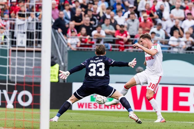WUERZBURG, GERMANY - AUGUST 24: Marius Buelter (Bülter, Bulter, 1. FC Koeln, 30) trying to score against Marko Rajkovacic (Wuerzburger Kickers, 33) during the 1st round DFB Pokal match between Wuerzburger Kickers vs. 1. FC Koeln at AKON ARENA on August 24, 2026 in Wuerzburg, Germany. DFB REGULATIONS PROHIBIT ANY USE OF PHOTOGRAPHS AS IMAGE SEQUENCES AND OR QUASI-VIDEO. Bavaria Germany Copyright: xSteffiexWunderlx