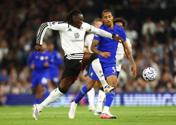 Fulham v Chelsea, English Premier League, Craven Cottage, London, 24 08 2026 Calvin Bassey (3) of Fulham is pressured by forward Joao Pedro (9) of Chelsea during the Premier League game at Craven Cottage London Craven Cottage London GBR, UK NEWSPAPERS OUT Copyright: xMarkxGreenwoodx