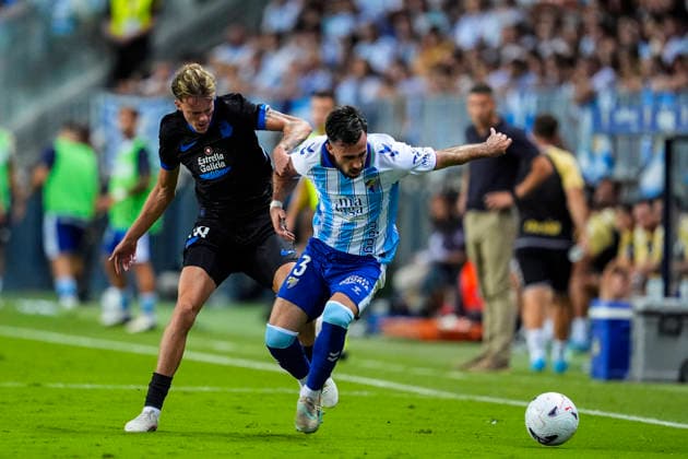August 24, 2026, Malaga, Malaga, Spain: Riki Rodriguez of RC Deportivo and Carlos Puga of Malaga CF in action during the Spanish league, LaLiga EA Sports, football match played between Malaga CF and RC Deportivo at La Rosaleda stadium on August 24, 2026, in Malaga, Spain. Malaga CF V RC Deportivo - LaLiga EA Sports  - ZUMAa181 20260824_zaa_a181_149 Copyright: xJoaquinxCorcherox