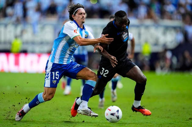 August 24, 2026, Malaga, Malaga, Spain: Angel Recio of Malaga CF and Bil Nsongo of RC Deportivo in action during the Spanish league, LaLiga EA Sports, football match played between Malaga CF and RC Deportivo at La Rosaleda stadium on August 24, 2026, in Malaga, Spain. Malaga Spain - ZUMAa181 20260824_zaa_a181_155 Copyright: xJoaquinxCorcherox