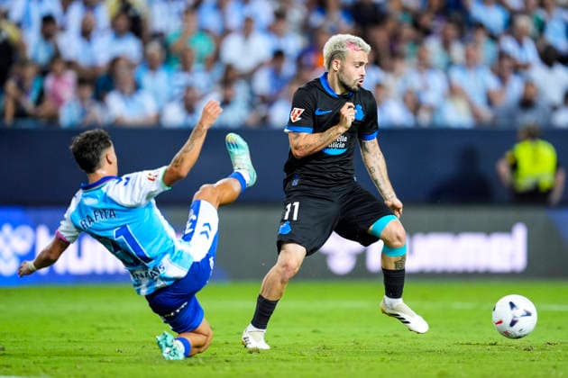 August 24, 2026, Malaga, Malaga, Spain: Rafita Garrido of Malaga CF and David Mella of RC Deportivo in action during the Spanish league, LaLiga EA Sports, football match played between Malaga CF and RC Deportivo at La Rosaleda stadium on August 24, 2026, in Malaga, Spain. Malaga CF V RC Deportivo - LaLiga EA Sports  - ZUMAa181 20260824_zaa_a181_158 Copyright: xJoaquinxCorcherox
