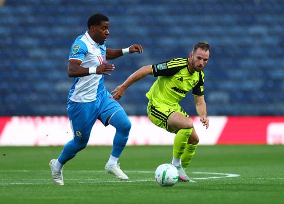Blackburn, England, 25th August 2026. Jayden Fevrier of Blackburn Rovers tussles with Rhys Norrington Davies of Sheffield United during the Blackburn Rovers vs Sheffield United Carabao Cup Second Round match at Ewood Park, Blackburn. Picture credit should read: Simon Bellis Sportimage EDITORIAL USE ONLY. No use with unauthorised audio, video, data, fixture lists, club league logos or live services. Online in-match use limited to 120 images, no video emulation. No use in betting, games or single club league player publications. SPI_005_SB_BBurn_Sheffield_Unnited SPI-4935-0005