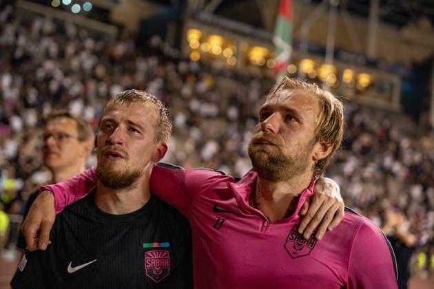 Tymoteusz Puchacz and Aleksey Isayev cries after advancing to the Champions League seen during UEFA Champions League 26 27 4th qualifying round 2ed leg match between teams of Sabah FK and Hapoel Beer Sheva (Lukasz Germaniuk Ball Raw Images) Baku Tofiq Bahramov Stadium Azerbaijan Copyright: xLukaszxGermaniukx GER_SABvHBS-35
