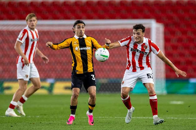 25th August 2026; Bet365 Stadium, Stoke, Staffordshire, England; Carabao Cup Football, Stoke City versus Hull City; Ryan Giles of Hull City and Laurence Giani of Stoke City look at the ball TimxWilliams