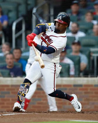 Second baseman Ozzie Albies 1 of the Atlanta Braves hits a sacrifice fly in the first inning against the Los Angeles Dodgers at Truist Park on Tuesday, August 25, 2026 in Atlanta, Georgia.  ATL20260825106 MikexZarrilli