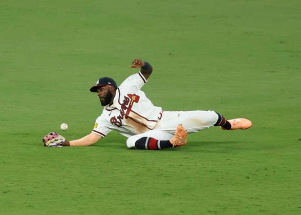 Centerfielder Michael Harris II of the Atlanta Braves dives but can t make a catch in the fourth inning against the Los Angeles Dodgers at Truist Park on Tuesday, August 25, 2026 in Atlanta, Georgia.  ATL20260825115 MikexZarrilli
