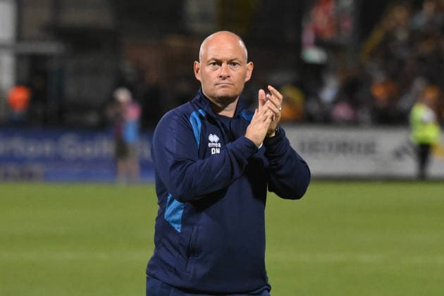 Cambridge United v Millwall - Carabao Cup Second Round Alex Neil, manager of Millwall, applauds fans after the final whistle during the Carabao Cup Second Round match between Cambridge United and Millwall at the Cledara Abbey Stadium in Cambridge, on August 25, 2026. Cambridge Cambridgeshire  Copyright: xMIxNewsx originalFilename:fletcher-cambridg260825_npKl6.jpg