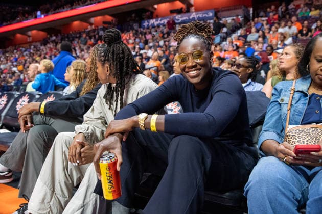 UNCASVILLE, CT - AUGUST 25: Former Connecticut Sun center Tina Charles poses for a photo with a can of SUNSET Hazy IPA beer during the WNBA, Basketball Damen, USA game between the Chicago Sky and the Connecticut Sun on August 25, 2026 at Mohegan Sun Arena in Uncasville, CT. SUNSET Hazy IPA beer is from Charles™ 78 Brewing Co., a Connecticut-based brewery and SUNSET Hazy IPA is dedicated to the players, fans and coaches who helped build the Connecticut Sun legacy and it is crafted with discipline and brewed with excellence. (Photo by Erica Denhoff Icon Sportswire) WNBA: AUG 25 Chicago Sky at Connecticut Sun EDITORIAL USE ONLY Icon26082521