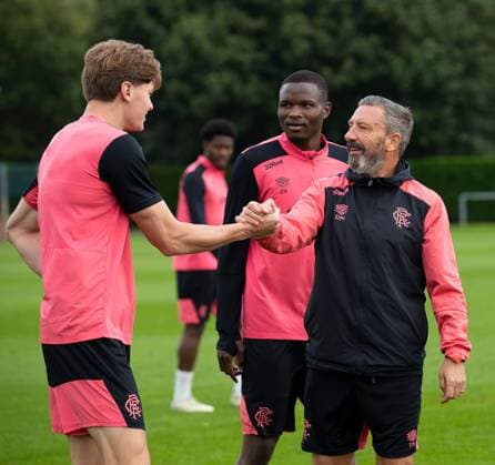 Rangers manager Derek McInnes shakes hands with Ryan Naderi at training ahead of tomorrow s UEFA Conference League qualifying match against Jablonec. Rangers Training - The Rangers Training Centre, Glasgow, Lanarkshire, Scotland, UK - 26 Aug 2026Glasgow The Rangers Training Centre Lanarkshire United Kingdom  Copyright: xO Rourke RangersxFC Shutterstockx 17117524y