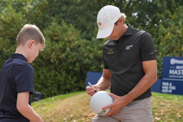 SUTTON COLDFIELD, ENGLAND - AUG 26: Joakim Lagergren (SWE) signs an autograph for a young fan during the Pro-Am at the 2026 Husqvarna British Masters at The Belfry, Sutton Coalfield on August 26, 2026 in Warwickshire, England The 2026 Husqvarna British Masters