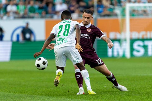 SOCCER - UEFA ECL, Rapid vs Hearts VIENNA,AUSTRIA,26.AUG.26 - SOCCER - UEFA Conference League, play-off, SK Rapid Wien vs Heart of Midlothian FC. Image shows Romeo Amane (Rapid) and Tomas Bent Magnusson (Hearts).  GEPAxpictures xPhilippxBrem