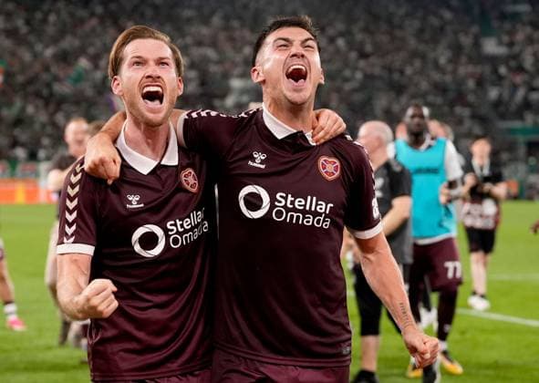 Jamie McCart (left) and Oisin McEntee of Heart of Midlothian celebrate after their side s victory over SK Rapid after a UEFA Conference League Play-Off Second Leg match between SK Rapid and Hearts at Weststadion on August 26, 2026 in Vienna, Austria. Rapid Vienna v Heart of Midlothian, UEFA Conference League, Play-Off Round, Second Leg, Football, Allianz Stadion, Vienna, Austria - 26 Aug 2026Vienna Allianz Stadion Austria  Copyright: xChristianxHofer Shutterstockx 17115048gw